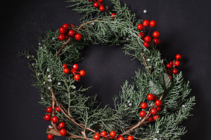 Christmas wreath detail of evergreen containing wreath, christmas, and berries