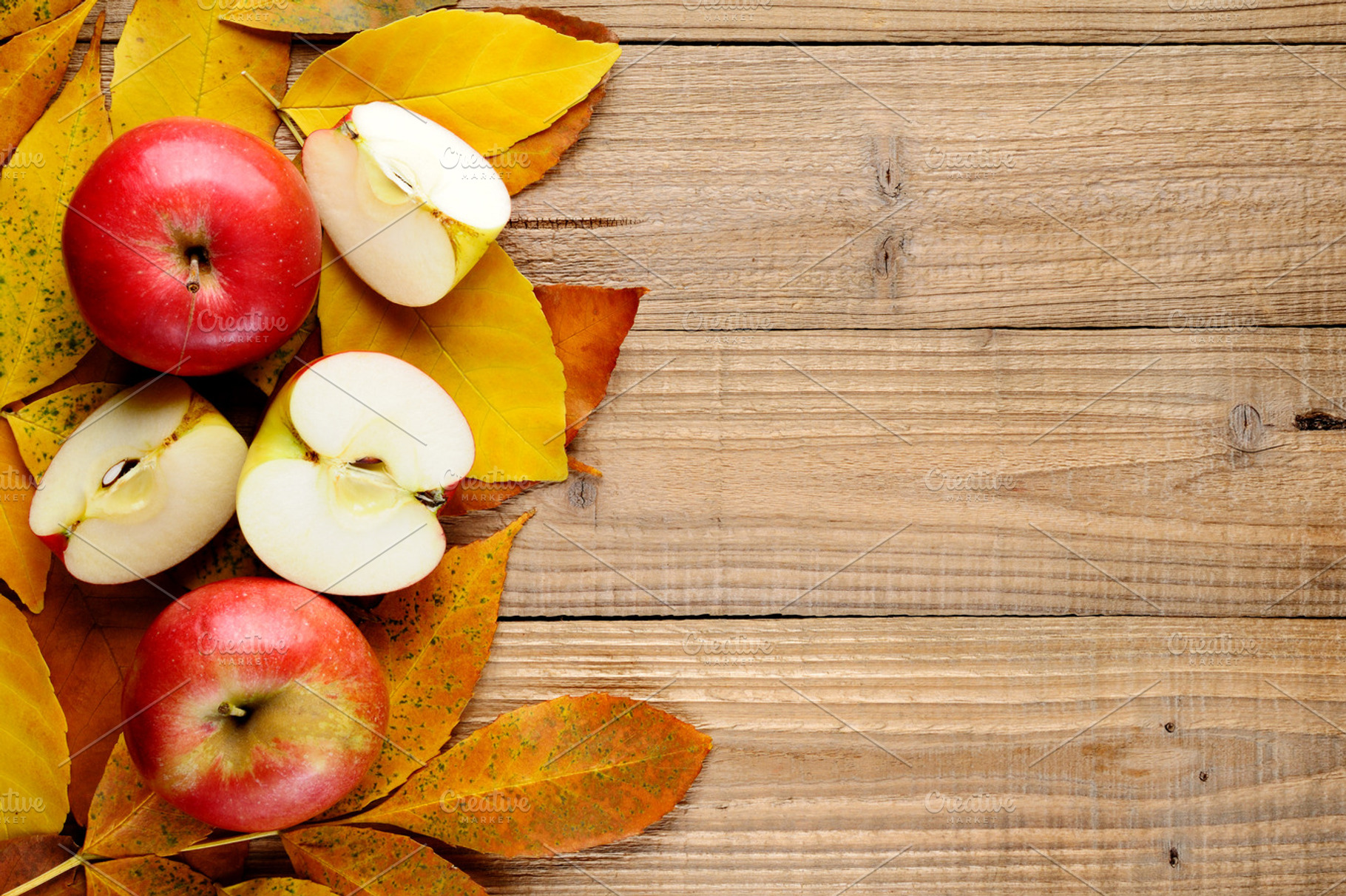 Apples on autumn leaves containing apple, fruit, and food