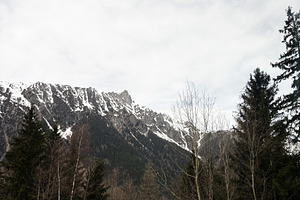 Scenic mountain view with snowy peaks and forest in a serene landscape Switzerl, a Photo by AS photostudio