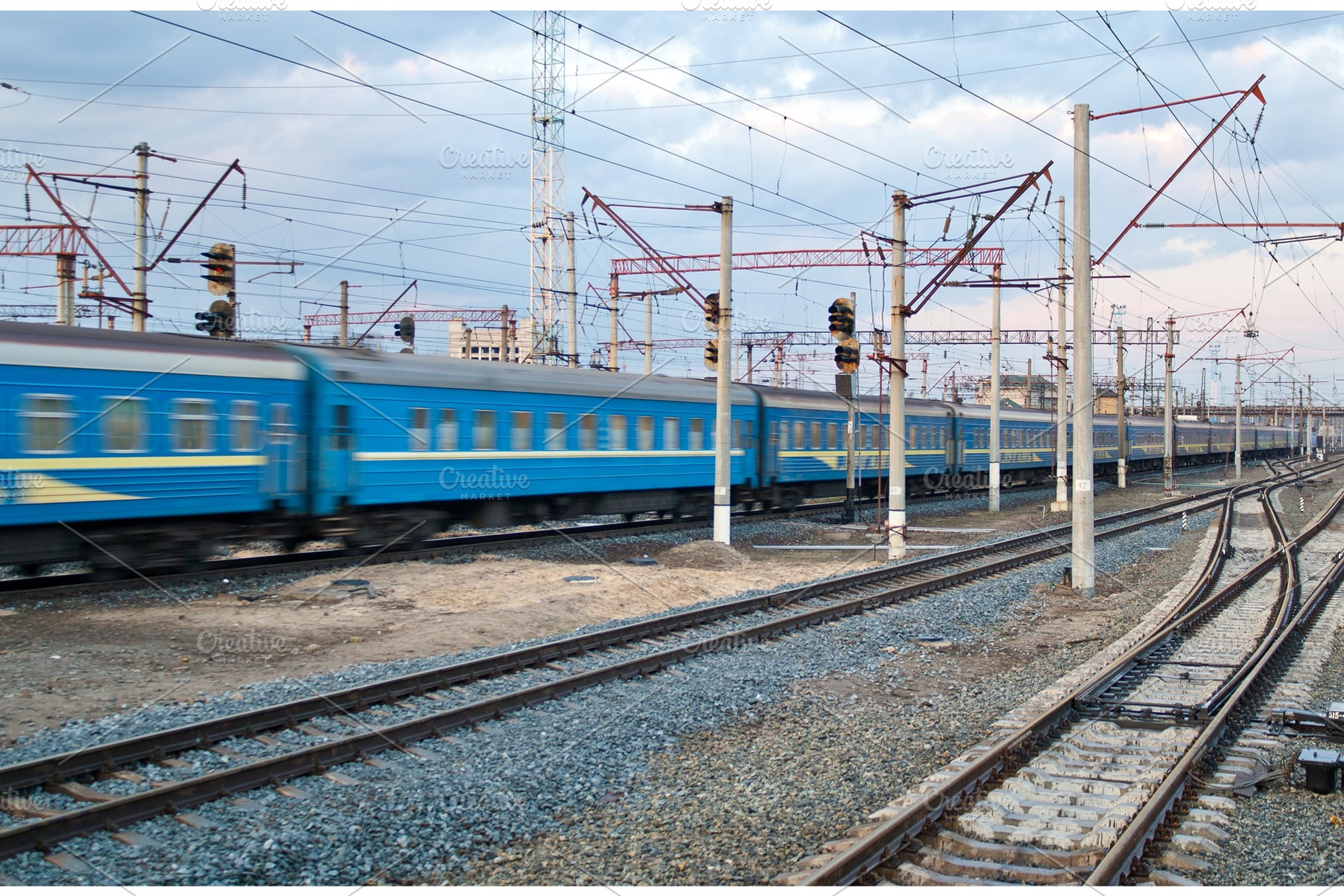 Passanger train passing the station, a Transportation Photo by Leonid Andronov