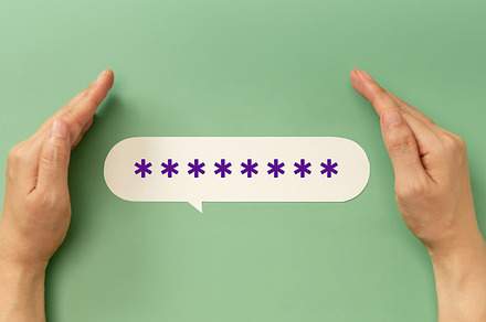 Hands protecting a hidden password speech bubble symbolizing onl