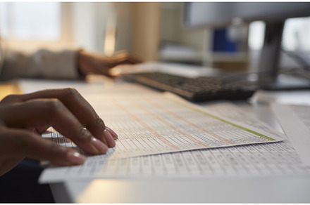 Woman accountant working in the, a Business Photo by StudioRomantic
