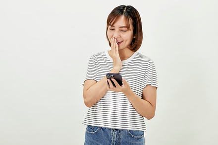 young asian woman smile happy use smart mobile phone, a Person Photo by 1981 Rustic studio kan