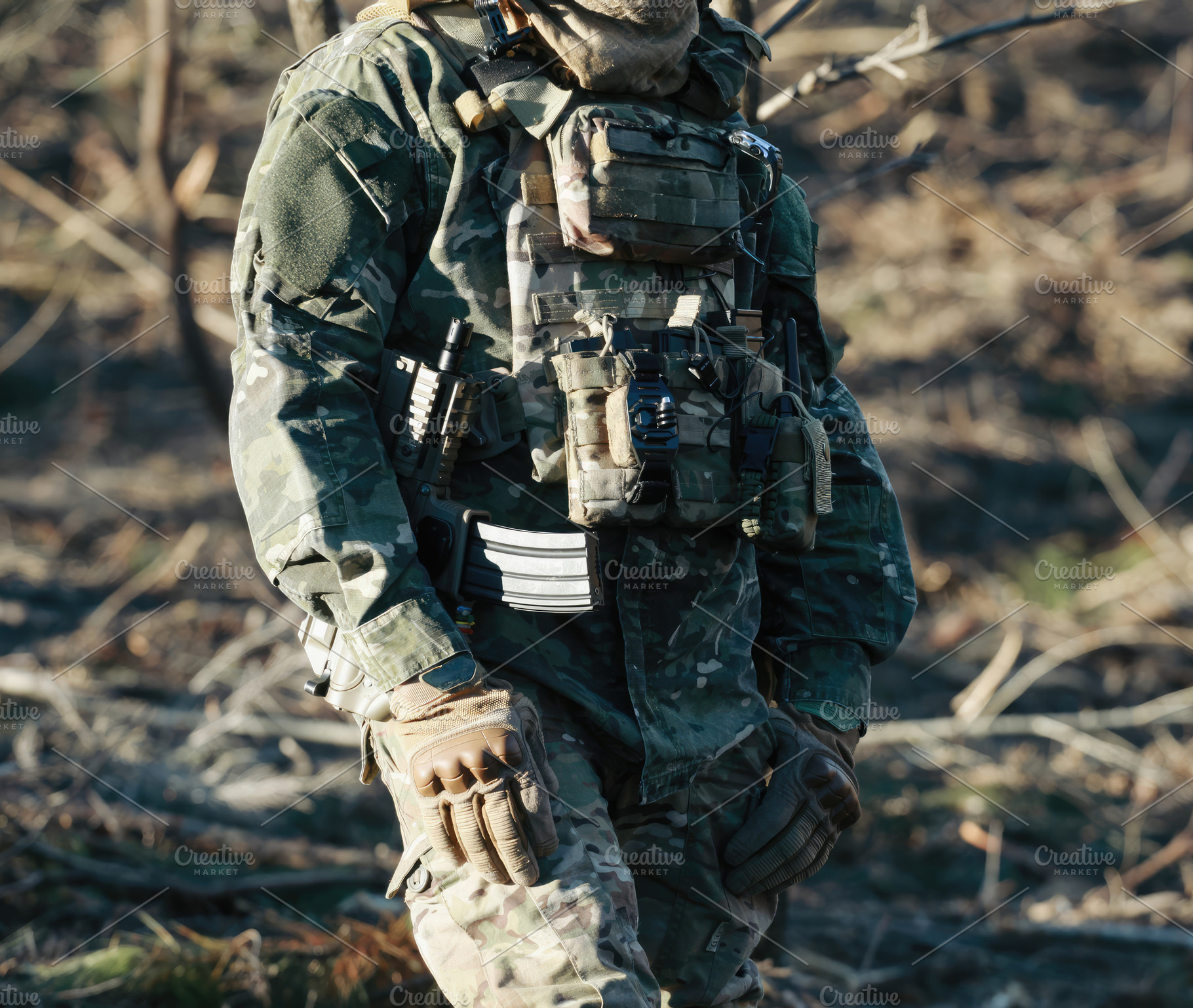 Soldier wearing camouflage uniform and tactical vest patrolling in forest, a Sports & Recreation Photo by Antonio Gravante Market
