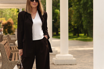 Stylish young woman posing outdoors