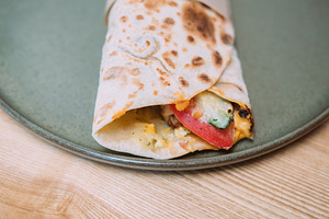 Doner kebab street food shawarma plate served, a Food & Drink Photo by Photo Drive Studio