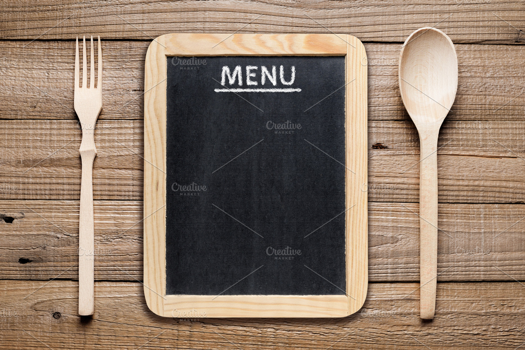 Menu board containing fork, spoon, and wooden, a Food & Drink Photo by Anatoliy Sadovskiy