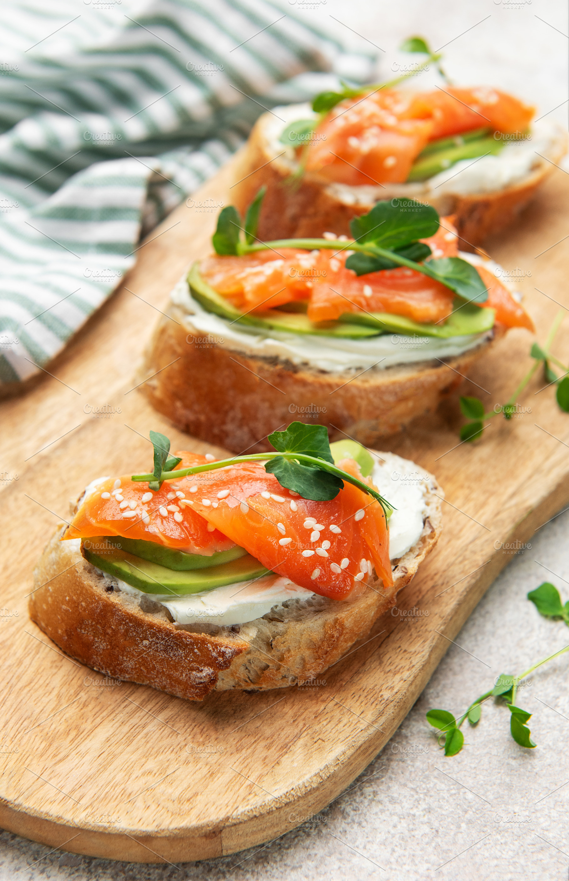 Smoked salmon toast with avocado and cream cheese, a Food & Drink Photo by Olena Rudo