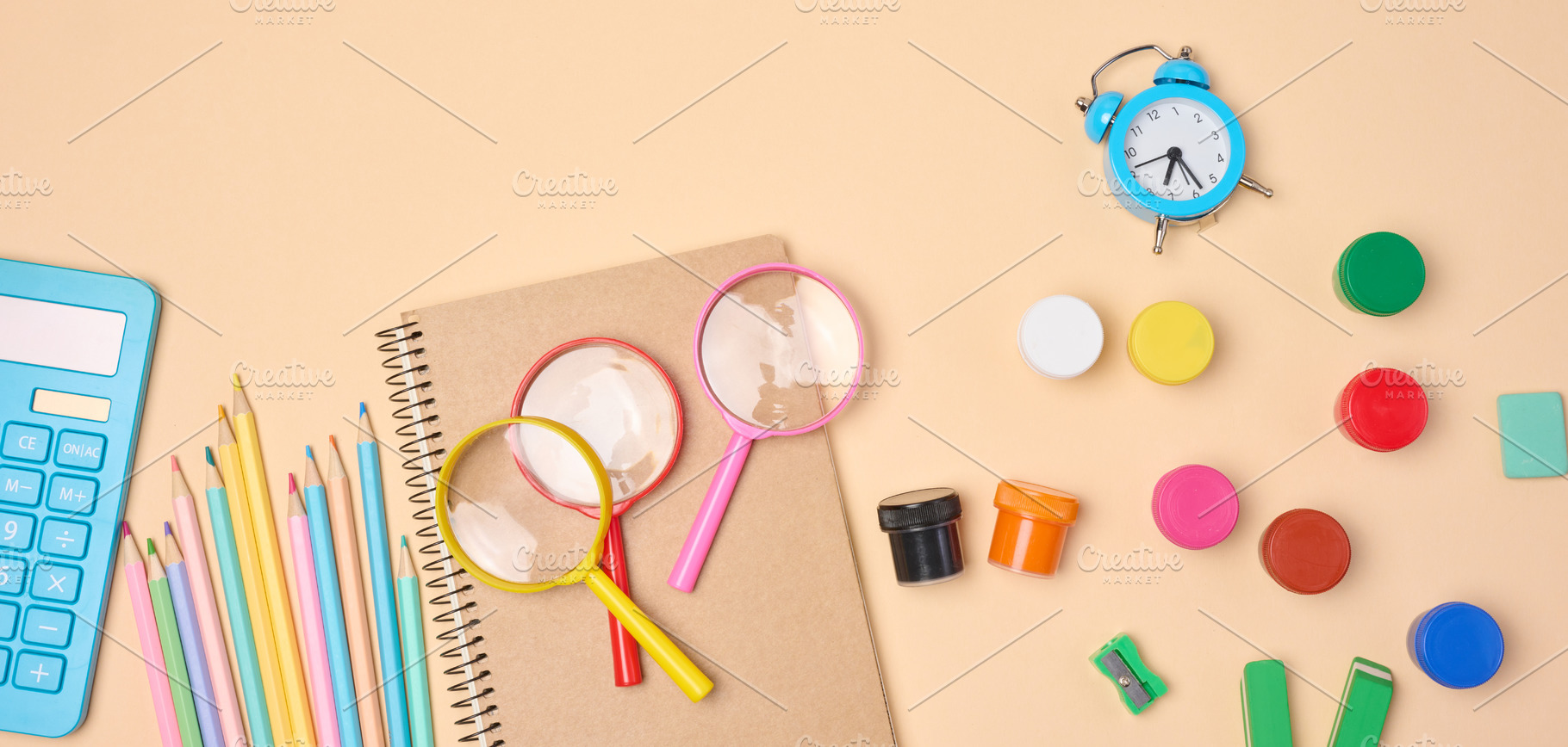 Stationery and school supplies such as pencils, magnifying glass, a School & Education Photo by ndanko