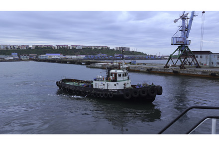 Fishing boat on background of port, a Nature Photo by Media Whale Stock