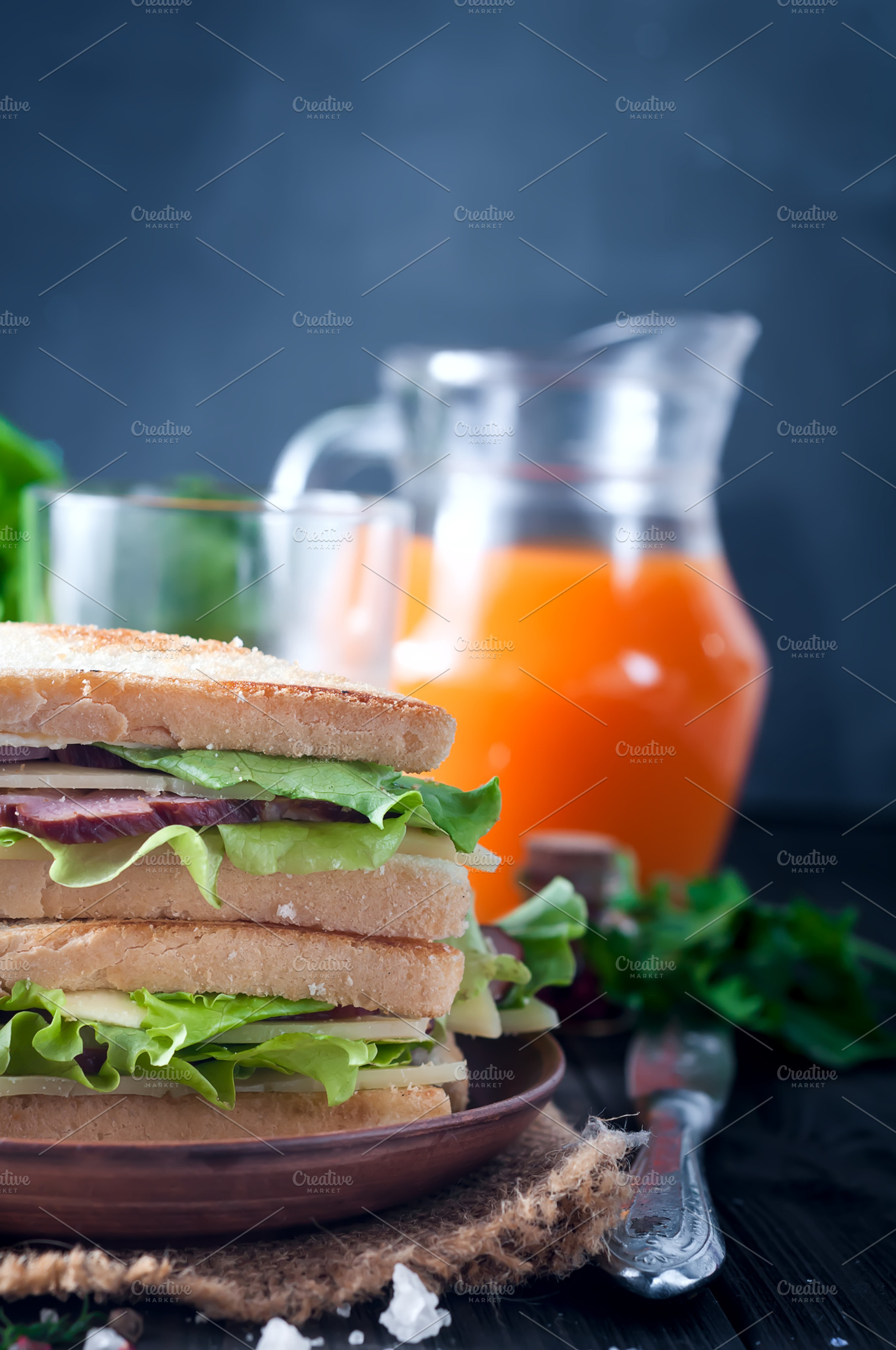 Club sandwiches on wood background stock photo containing sandwich and, a Food & Drink Photo by YuMyart