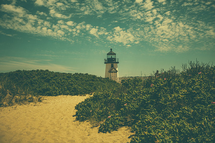 Lighthouse on the beach containing beach, sand, and waves preview 6