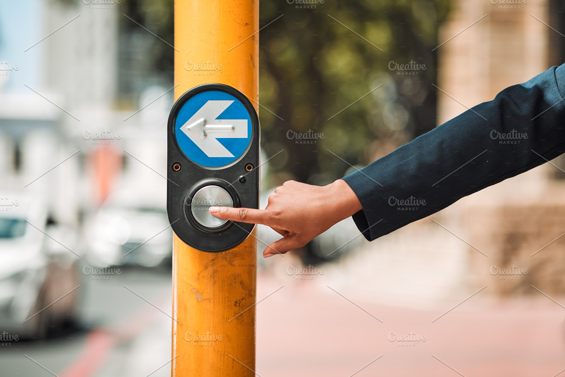 Woman, hands and arrow button on road in city for pedestrian crossing signal in safe travel outdoors. Female person touching sign, symbol or crosswalk by robot for safety on street in Cape Town, a Photo by Peopleimages.com