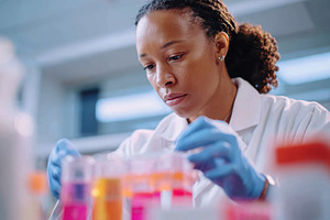 Scientist examining test tube in laboratory, a Health & Medical Photo by AlyaAnd