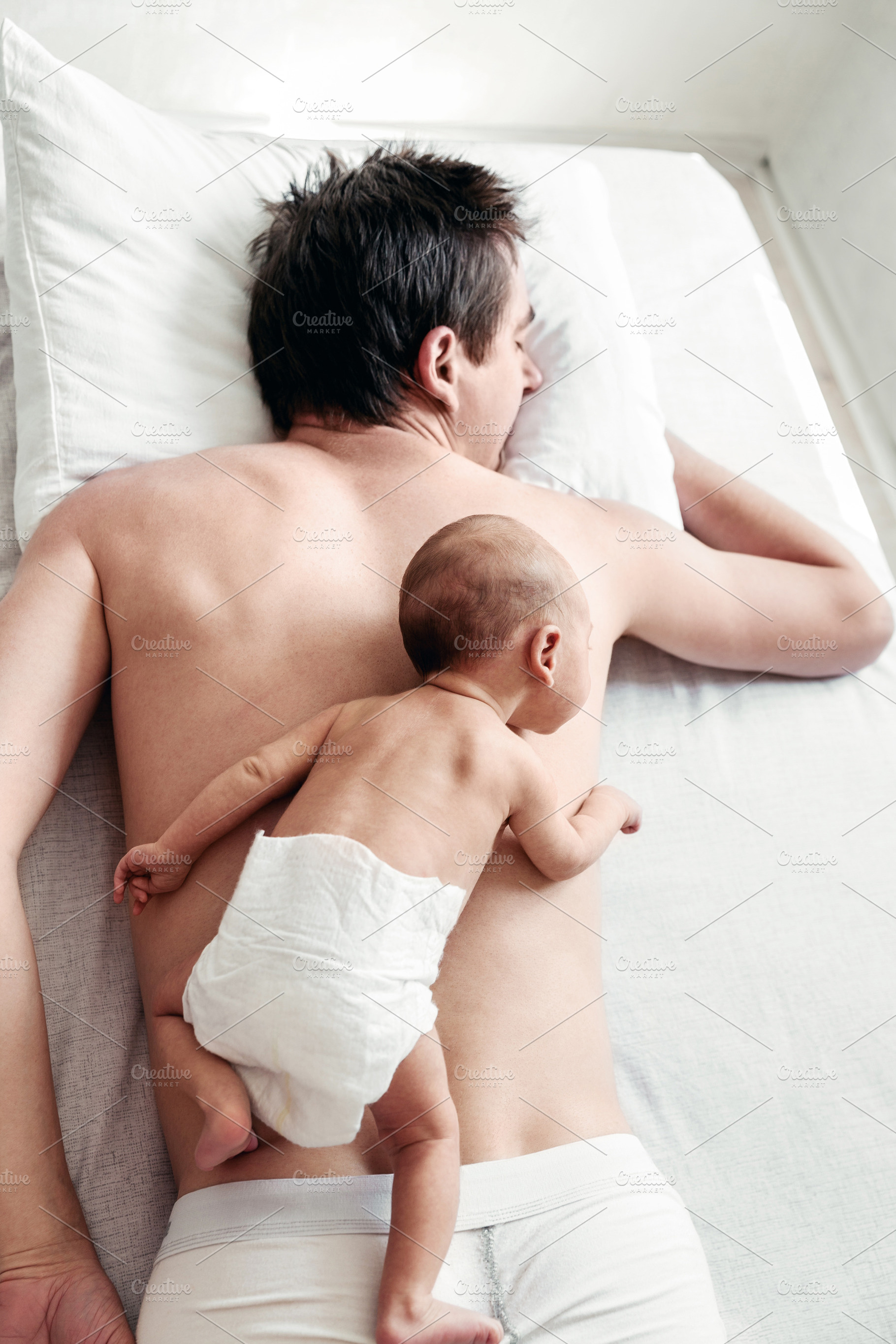 a newborn boy lies on his father's b, a Person Photo by Eni_fly