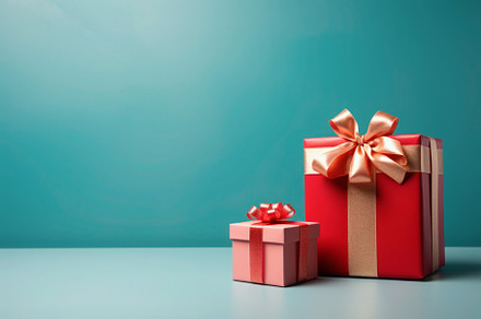 Red Christmas gift box against blue background, a Holiday Photo by Antonina Vlasova