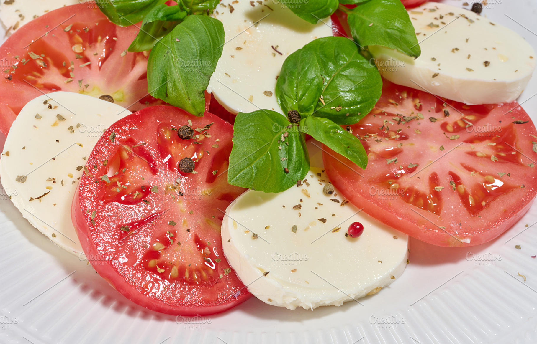 Classic Caprese salad with tomato slices, mozzarella and basil l, a Food & Drink Photo by ndanko