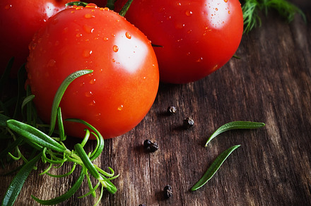 Ripe tomatoes and herbs stock picture