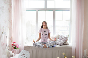 Girl in pajama meditating stock photo containing barefoot and soft