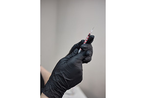 Gloved Hands Holding Syringe with, a Health & Medical Photo by wip3out