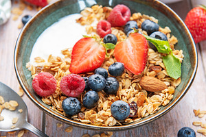 Healthy yogurt granola bowl with fresh berries, a Food & Drink Photo by Olena Rudo