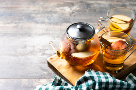Hot apple drink with spices on wooden table, a Food & Drink Photo by etorres69