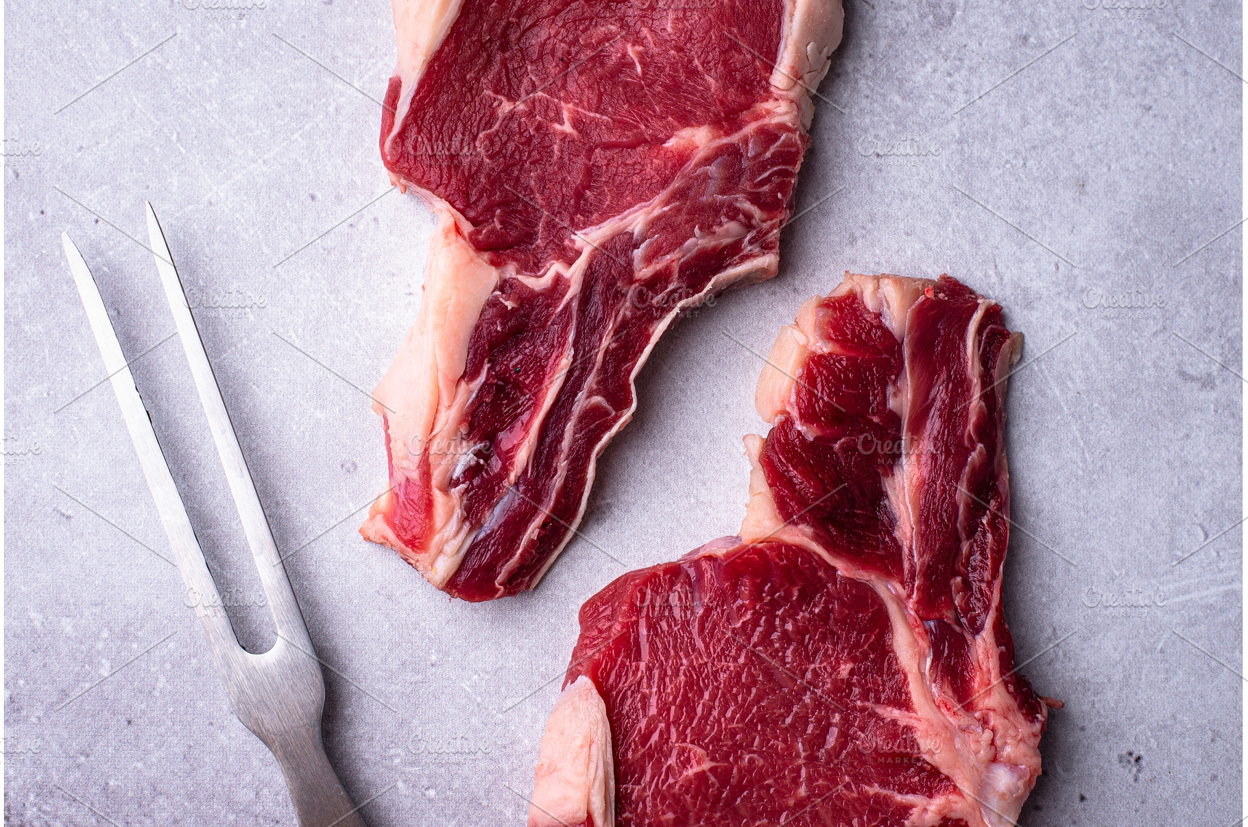 Raw uncooked beef steak antrecot, a Food & Drink Photo by Yulia Furman