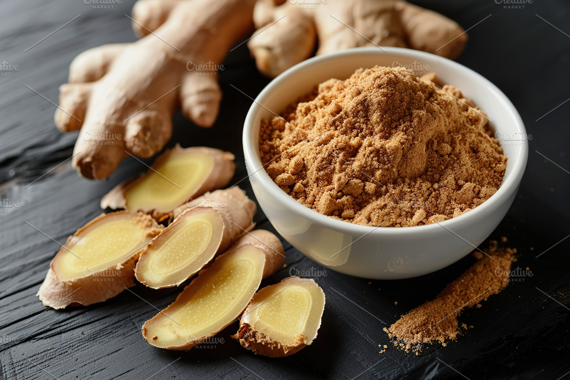 Ground dry ginger in bowl on wooden background, a Food & Drink Photo by AlyaAnd