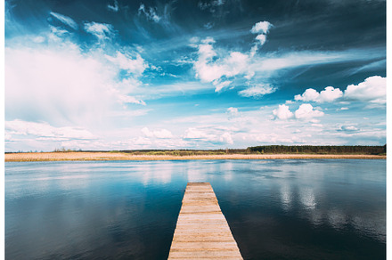 Old Wooden Boards Pier On Calm Water, a Nature Photo by Our Amazing World