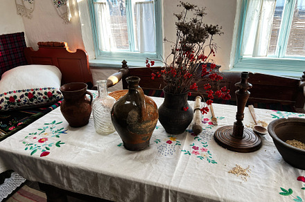 Traditional dining table with rustic decor and wooden furniture in cozy sunligh, a Photo by AS photostudio