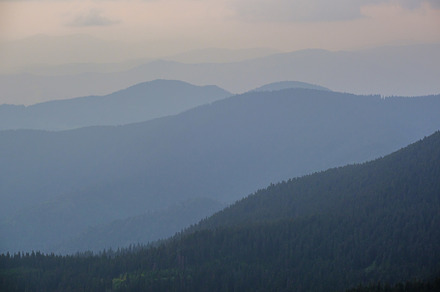Summer misty evening mountain tops containing sunset, sunrise, and mountains, a Nature Photo by YuriyB
