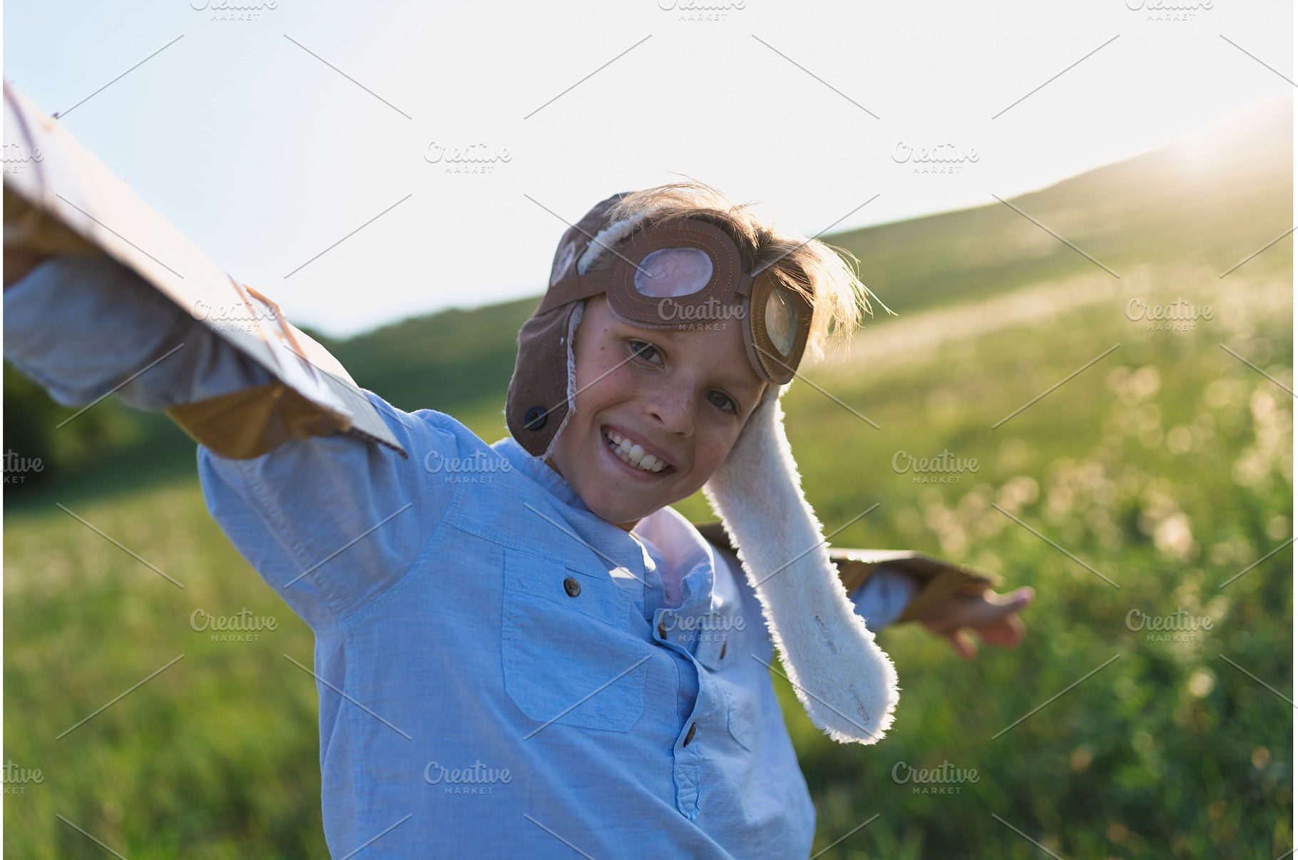 A small boy playing on a meadow in, a Person Photo by HalfPoint
