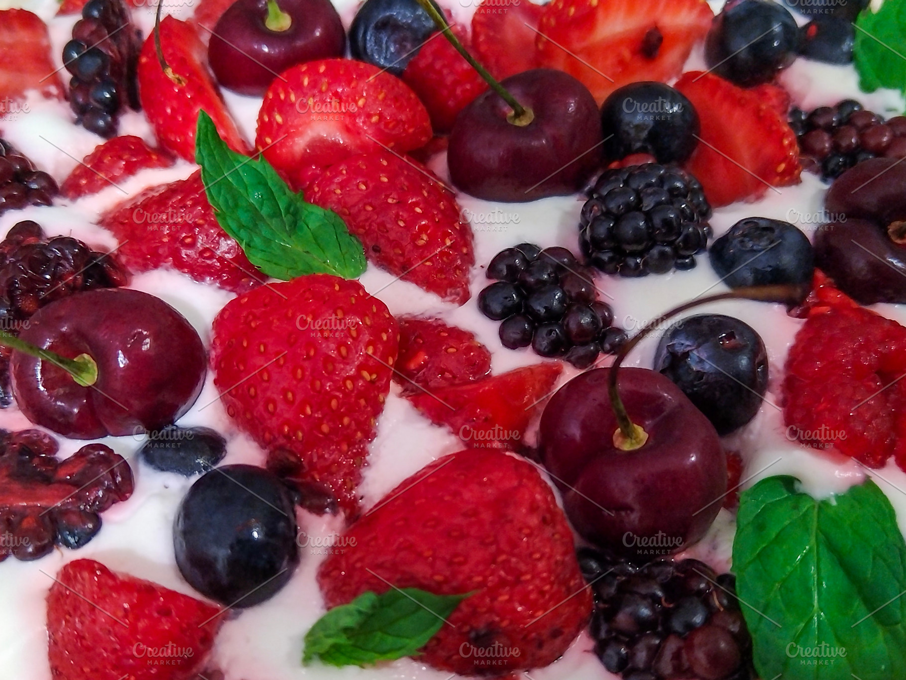 Cake topped with a variety of fresh berries, a Food & Drink Photo by DanFLCreativo