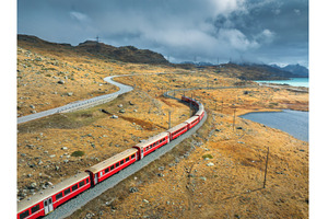 Aerial view of red train near azure, a Transportation Photo by den-belitsky