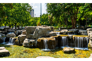 Artificial waterfall and rocks in, an Architecture Photo by Leonid Andronov