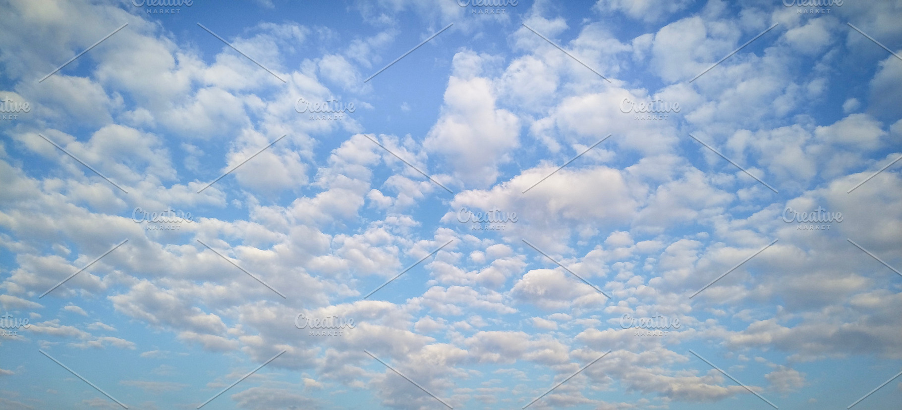 Cloudy blue sky background, a Nature Photo by DanFLCreativo