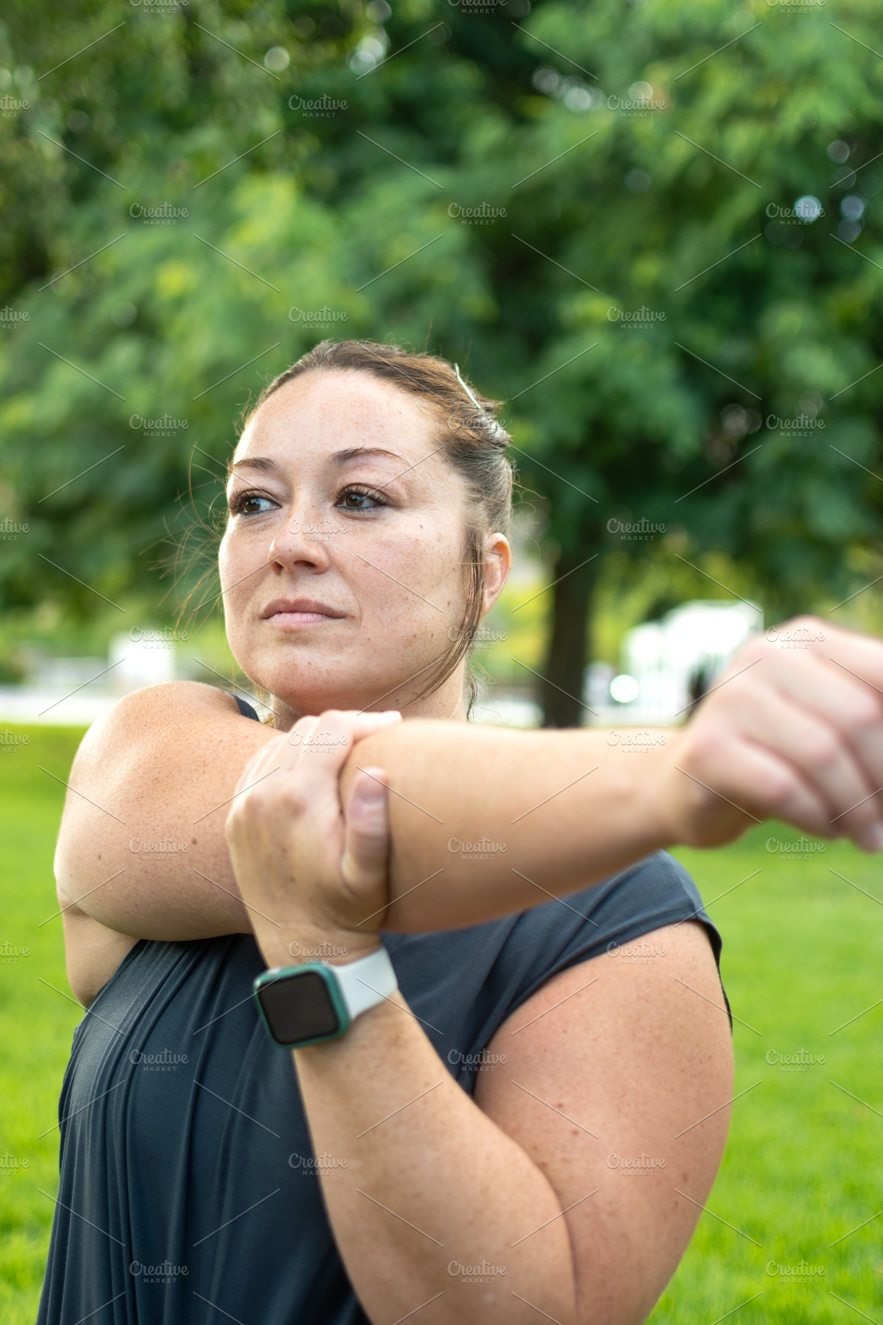 Athletic Woman Stretching Shoulder Before an Outdoor, a Sports & Recreation Photo by etorres69