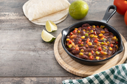 Mexican chilli beans with vegetables in iron pan