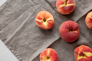 Fresh juicy ripe fig peaches, top view. Overhead. Copy space., a Food & Drink Photo by LiudmylaChuhunova