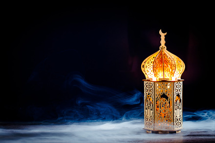 Ramadan Kareem background with ornamental wooden lantern glowing at night. Musl, a Holiday Photo by photoguns
