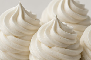 Swirled white cream texture, perfect for dessert background, a Photo by Dvoevnore photos