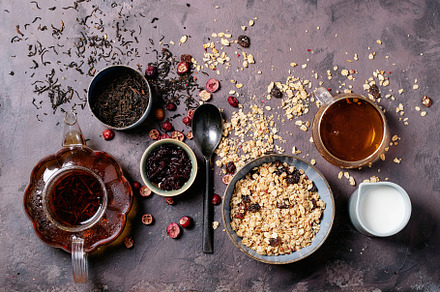 Granola breakfast in ceramic bowl featuring above, black, and bowl