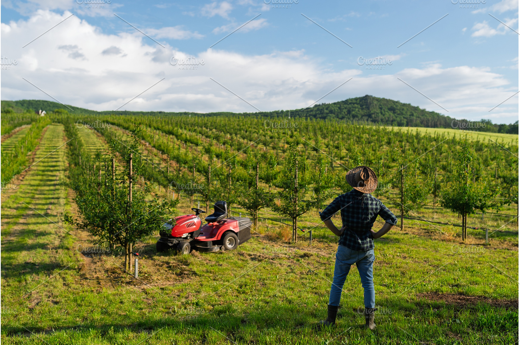 A mature farmer walking outdoors in, a Person Photo by HalfPoint