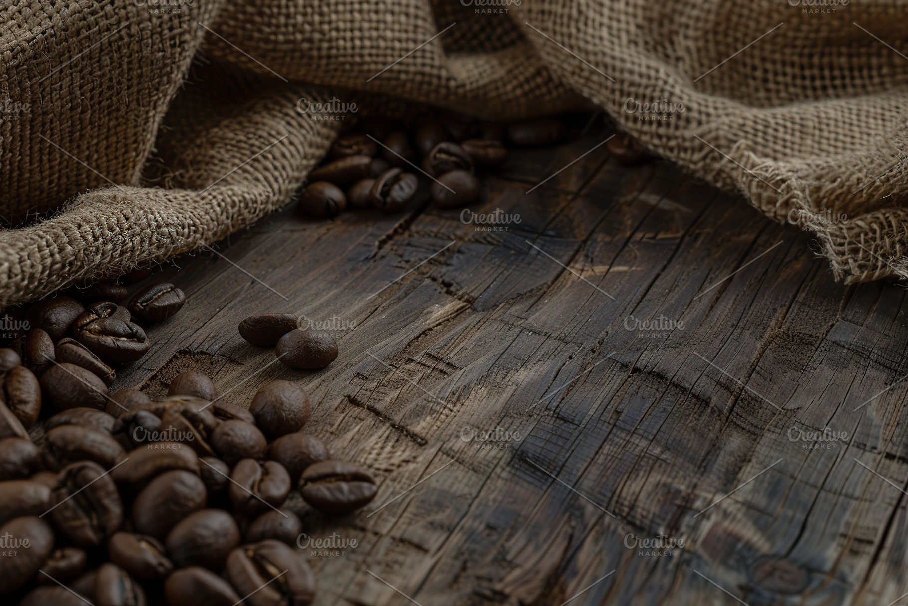Sackcloth with heap of coffee beans on wooden table, a Food & Drink Photo by AlyaAnd