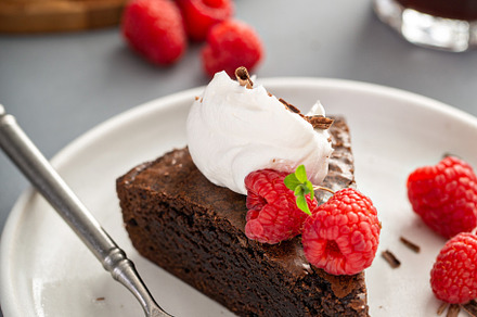 Brownie cake topped with fresh raspberries, a Food & Drink Photo by farwasser