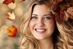 Smiling young woman enjoying autumn season, colorful fall leaves, a Person Photo by Studio ANNA