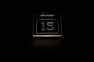Glowing number 15 sign on a dark background, modern minimal design, perfect for, a Background Photo by Ales Munt