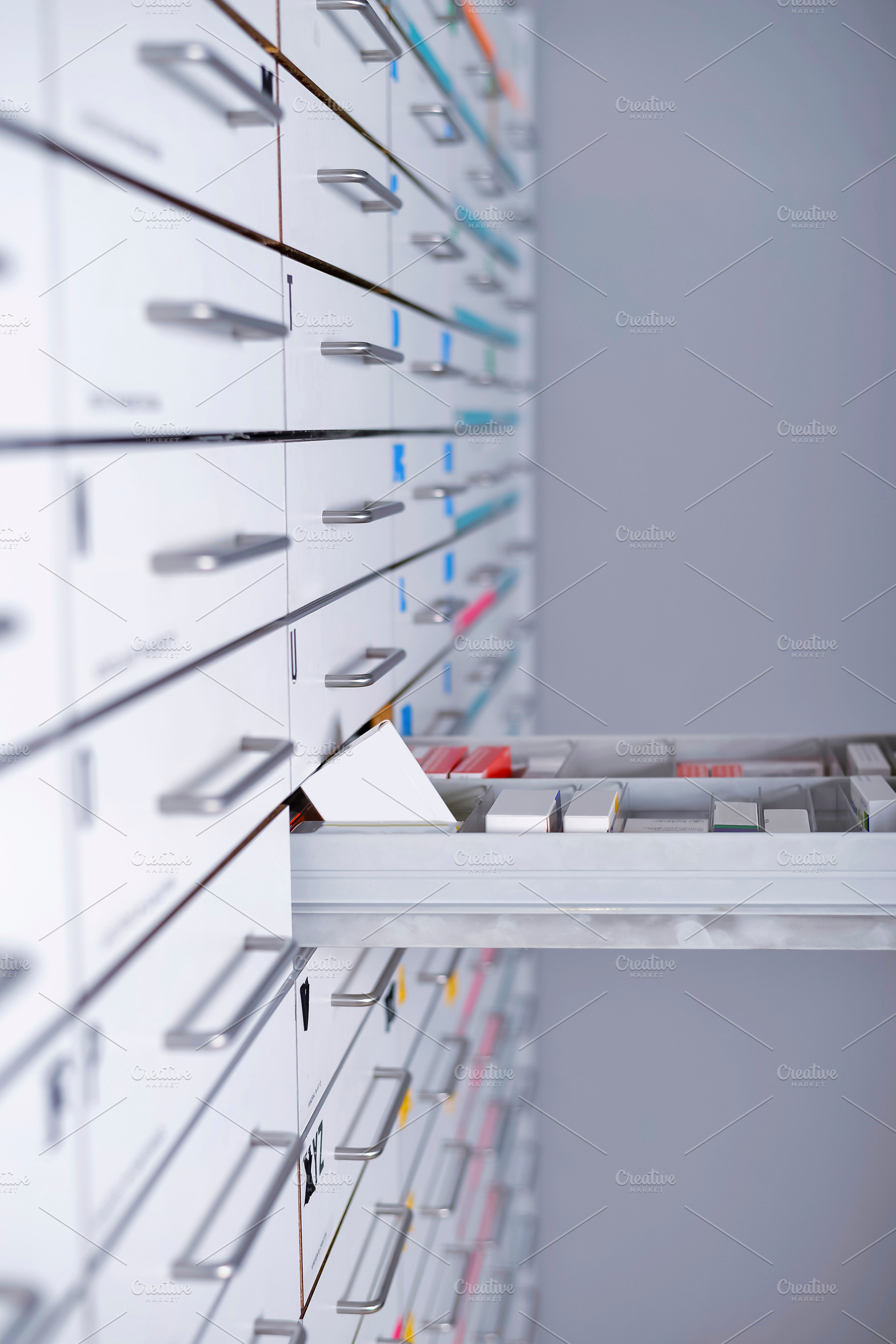 Pharmacy cabinet from side of drawer containing isolated, office, and people, a Health & Medical Photo by 2Design