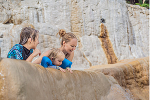 Mother with her toddler and teenage, a Holiday Photo by Elizaveta Galitskaya