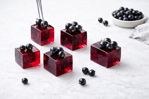 Blackcurrant jelly cubes garnished w, a Photo by Dvoevnore photos